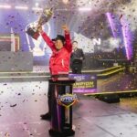 Tatay Benigno holding his trophy