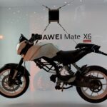 Motorcyle-suspended-by-the-Huawei-Mate-X6s-carbon-fibre-screen-plate