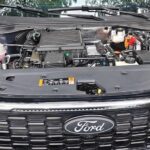 engine bay with the electric motor on the right portion
